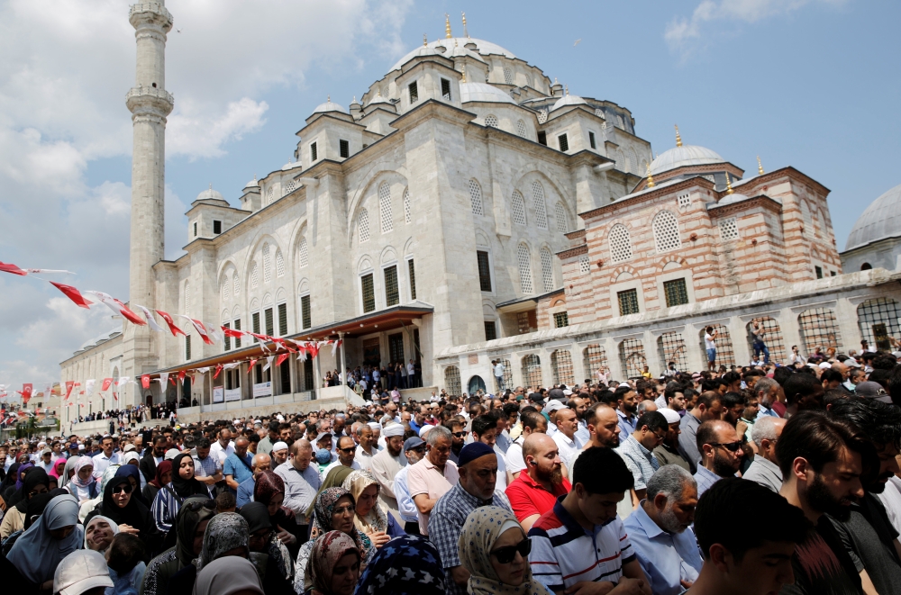 People attend a symbolic funeral prayer for the former Egyptian president Mohamed Mursi at the courtyard of Fatih Mosque in Istanbul, Turkey, June 18, 2019. REUTERS/Murad Sezer