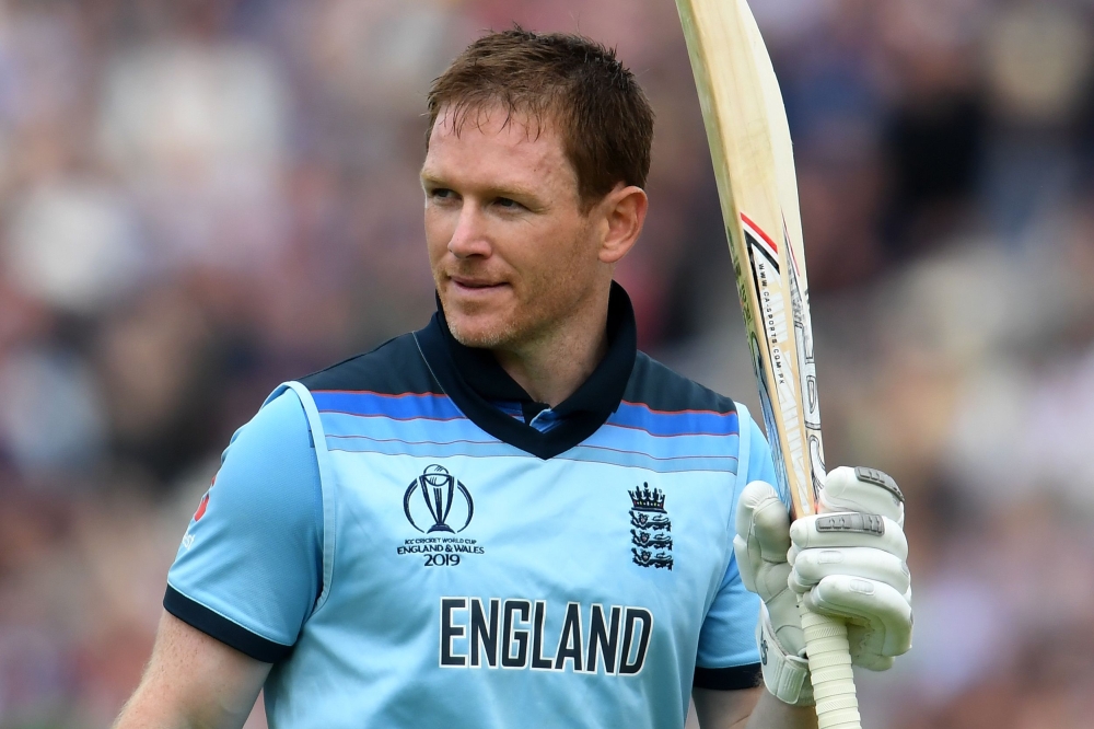 England's captain Eoin Morgan walks back to the pavilion after losing his wicket for 148 runs during the 2019 Cricket World Cup group stage match between England and Afghanistan at Old Trafford in Manchester, northwest England, on June 18, 2019. AFP / Dib