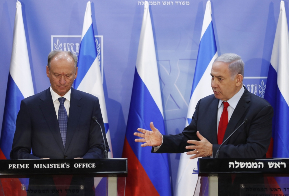Secretary of Russia's Security Council Nikolai Patrushev, listens as Israeli Prime Minister Benjamin Netanyahu speaks in Jerusalem on June 24, 2019. AFP/Pool/Ronen Zvulun 
