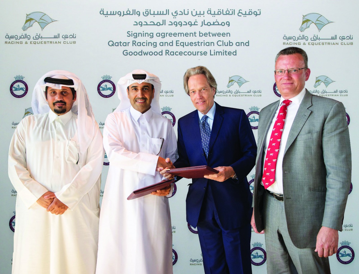 Qatar Racing & Equestrian Club (QREC) Chairman Issa bin Mohammed Al Mohannadi and the Duke of Richmond, owner of Goodwood Racecourse exchange documents during the sponsorship signing ceremony. QREC CEO Nasser bin Sherida Al Kaabi is also present.
