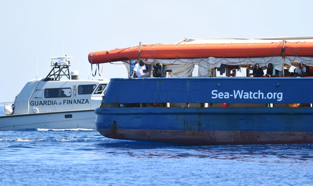 The migrant search and rescue ship Sea-Watch 3 carrying stranded migrants, sails near the island of Lampedusa, Italy, June 26, 2019. REUTERS/Guglielmo Mangiapane