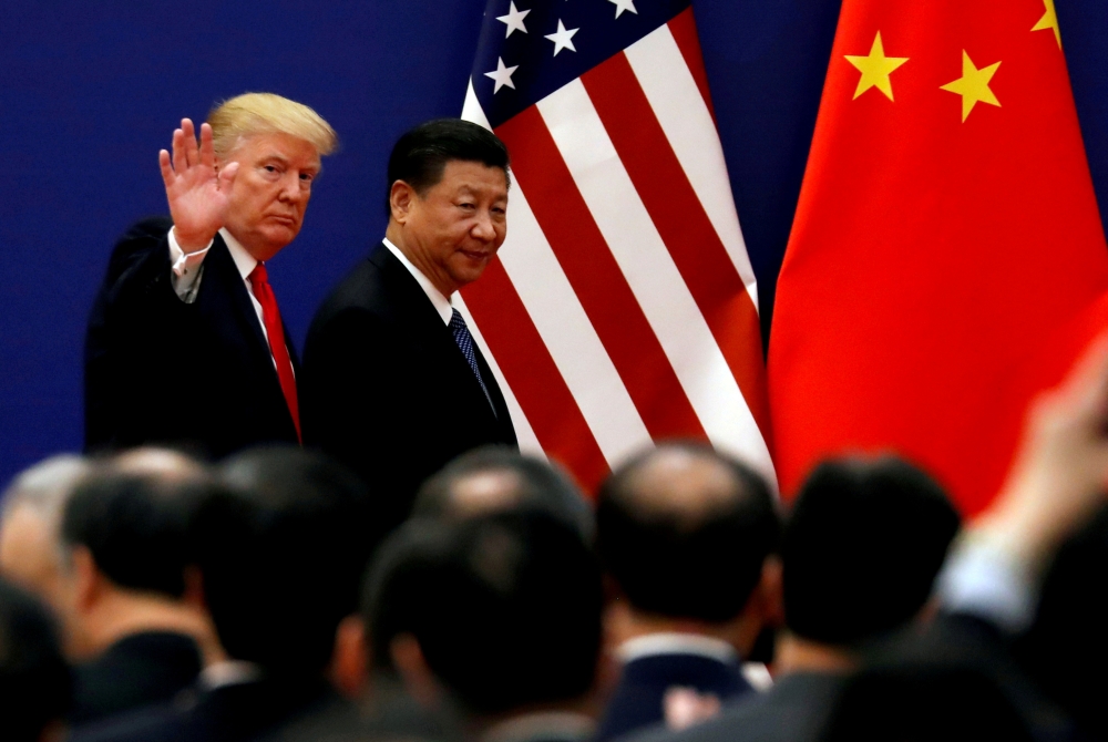 File photo of U.S. President Donald Trump and China's President Xi Jinping meet business leaders at the Great Hall of the People in Beijing, China, November 9, 2017. REUTERS/Damir Sagolj/File Photo