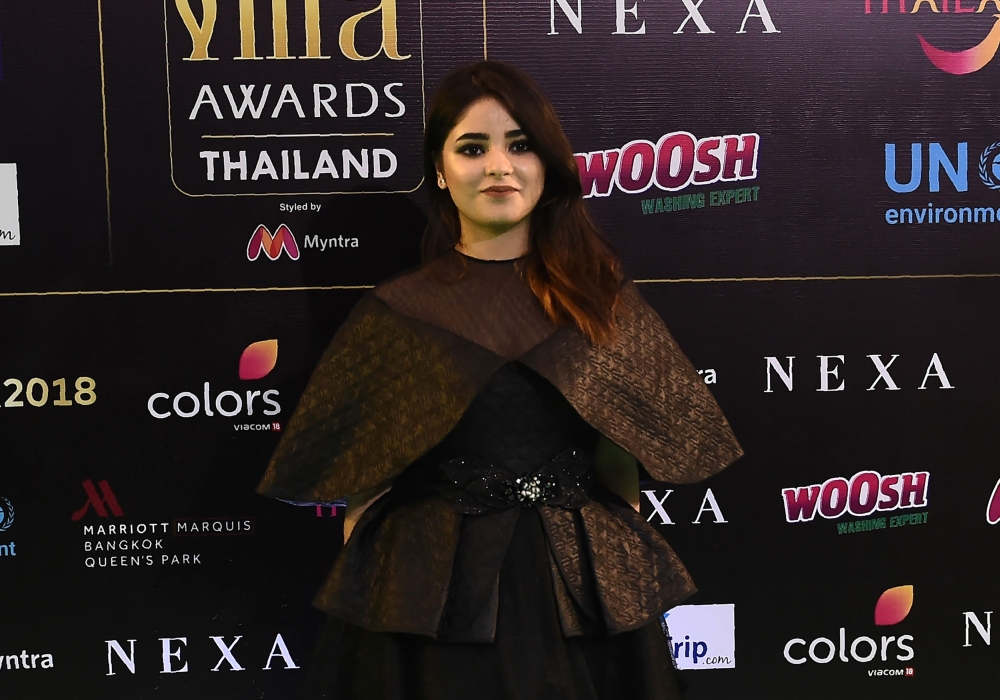 In this file photo taken on June 24, 2018 Bollywood actress Zaira Wasim poses for a picture as she arrives for the IIFA Awards of the 19th International Indian Film Academy (IIFA) festival at the Siam Niramit Theatre in Bangkok.  / AFP / LILLIAN SUWANRUMP