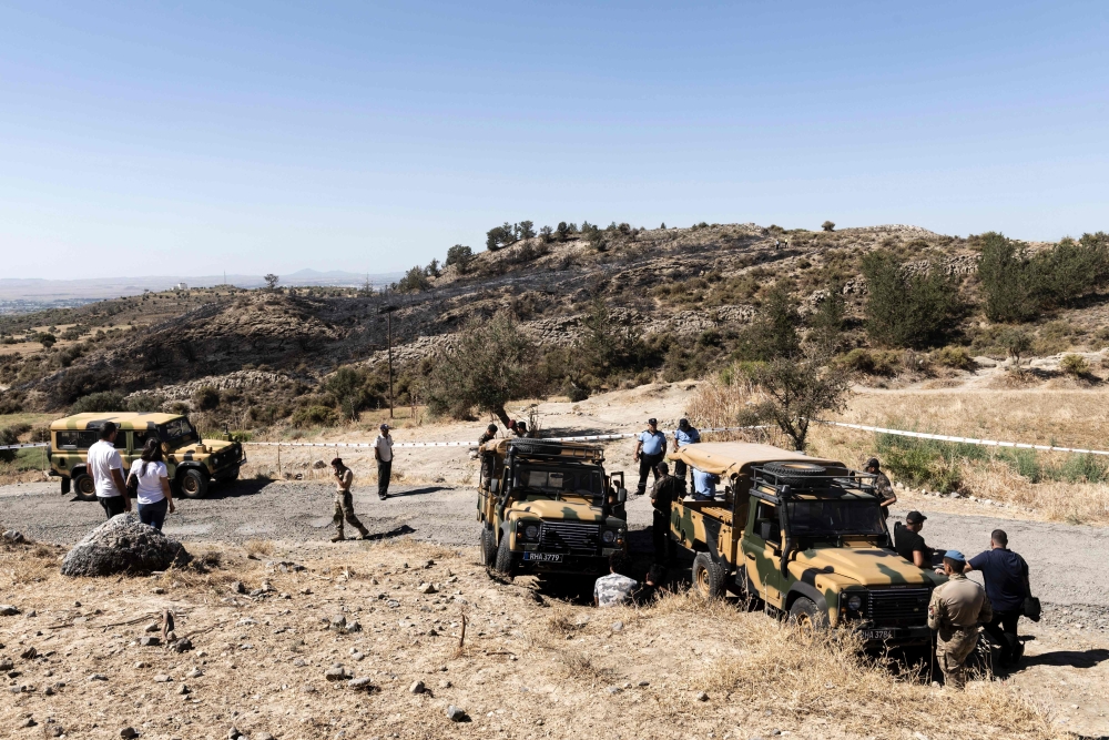 Members of the northen Cypriot security forces gather at the scene where according to officials a suspected Russian missile exploded overnight on July 1, 2019, in the divided island, during an Israeli aerial raid in Syria. AFP / Lakovos Hatzistavrou