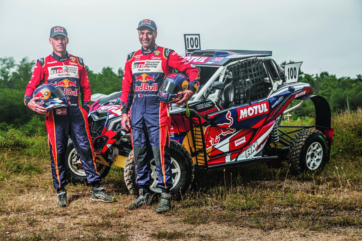 Nasser Saleh Al Attiyah and his co-driver Mathieu Baumel pose for a picture during their SxS buggy adventure at the 6 Hours Endurance Race in Orleans.
