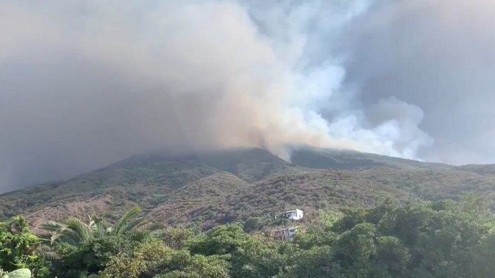  Ash and smoke rises after a volcano eruption started forest fires in Stromboli, Italy, July 3, 2019 in this still image obtained from social media video. Gernot Werner Gruber via Reuters