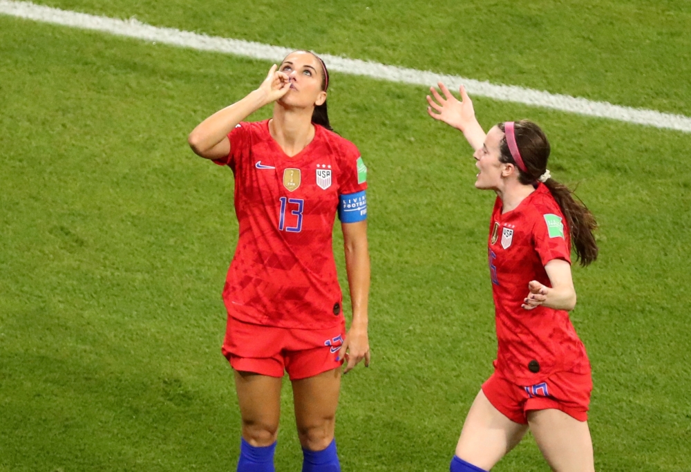 Alex Morgan of the US celebrates scoring their second goal with Rose Lavelle (REUTERS/Lucy Nicholson/File Photo)