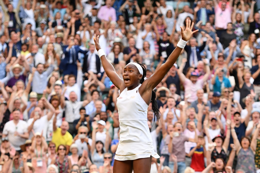 US player Cori Gauff celebrates beating Slovenia's Polona Hercog during their women's singles third round match on the fifth day of the 2019 Wimbledon Championships at The All England Lawn Tennis Club in Wimbledon, southwest London, on July 5, 2019. (AFP 