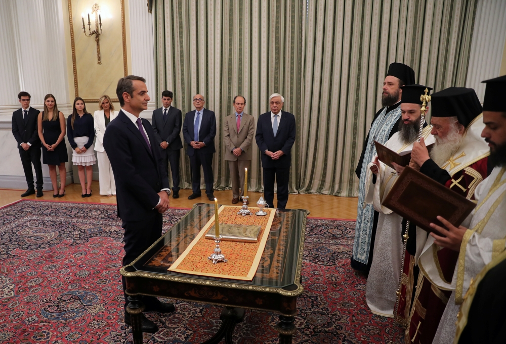 Leader of New Democracy conservative party and winner of Greek general election Kyriakos Mitsotakis is sworn in as prime minister during a ceremony at the Presidential Palace in Athens, Greece July 8, 2019. (REUTERS/Alkis Konstantinidis)