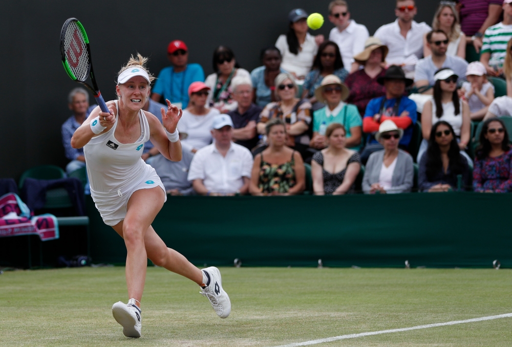 US player Alison Riske returns against Australia's Ashleigh Barty during their women's singles fourth round match on the seventh day of the 2019 Wimbledon Championships at The All England Lawn Tennis Club in Wimbledon, southwest London, on July 8, 2019. (