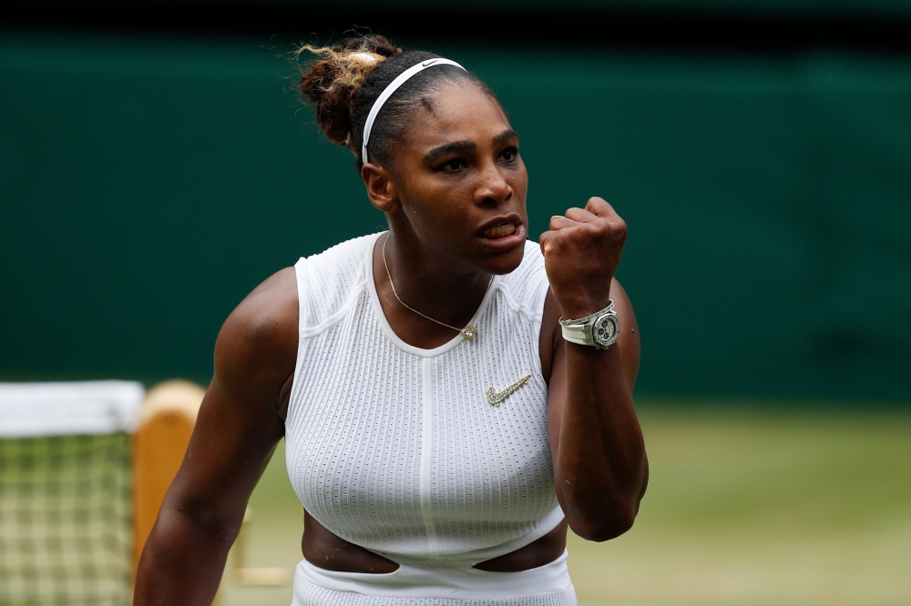 US player Serena Williams celebrates winning a point against US player Alison Riske during their women's singles quarter-final match on day eight of the 2019 Wimbledon Championships at The All England Lawn Tennis Club in Wimbledon, southwest London, on Ju