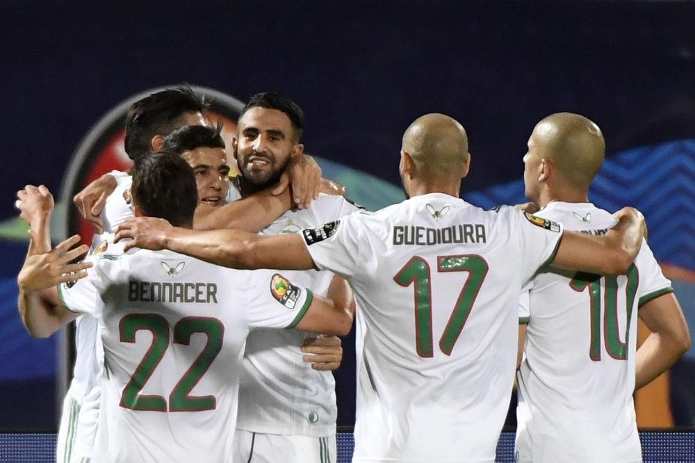 Algeria's forward Riyad Mahrez (4th-L) celebrates after scoring a goal during the 2019 Africa Cup of Nations (CAN) Round of 16 football match between Algeria and Guinea at the 30 June Stadium in the Egyptian capital Cairo on July 7, 2019. AFP / Khaled Des