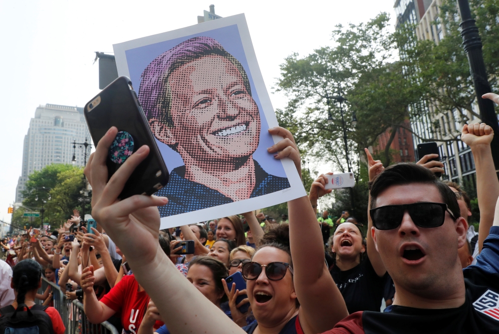 A fan holds up a sign of Megan Rapinoe of the U.S. during the parade. Reuters/Mike Segar