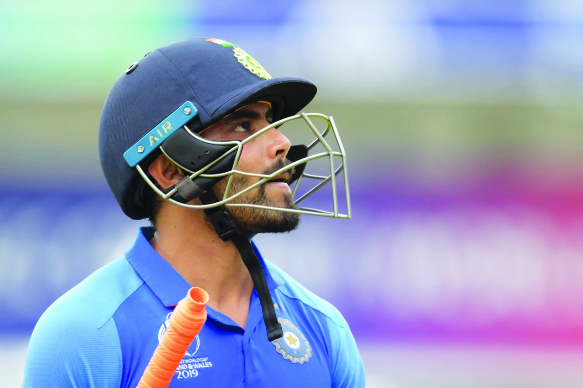 India's Ravindra Jadeja walks off for 77 during the 2019 Cricket World Cup first semi-final between New Zealand and India at Old Trafford in Manchester, northwest England, on July 10, 2019. AFP / Dibyangshu Sarkar