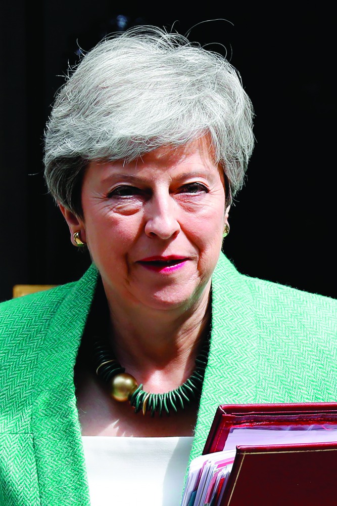 Britain's Prime Minister Theresa May leaves 10 Downing Street in London on July 10, 2019, ahead of the weekly Prime Minister's Questions (PMQs) question and answer session in the House of Commons.  AFP / Tolga Akmen
