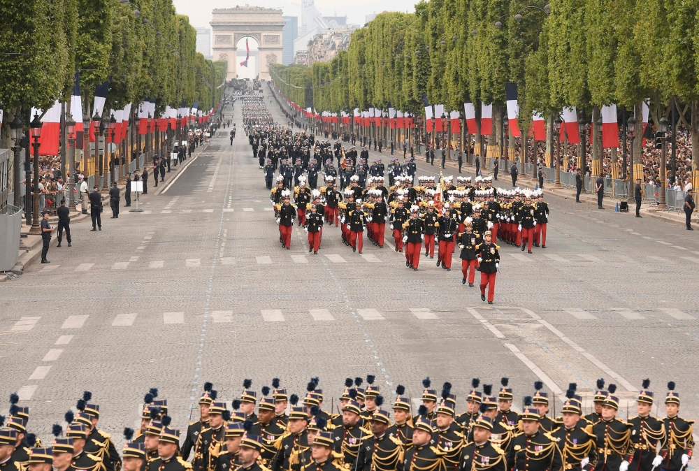 French soldiers march during the Bastille Day military parade down the Champs-Elysees avenue in Paris on July 14, 2019. / AFP / Lionel Bonaventure 