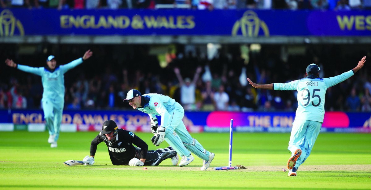 England's Jos Buttler runs out New Zealand's Martin Guptill during the super over to win the World Cup. (Action Images via Reuters/Peter Cziborra)