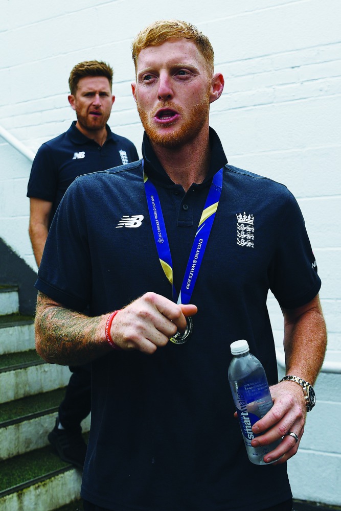 England's Ben Stokes (R) attends a World Cup victory event at The Oval in London on July 15, 2019, a day after they won the 2019 Cricket World Cup final against New Zealand. AFP / Daniel Leal-Olivas