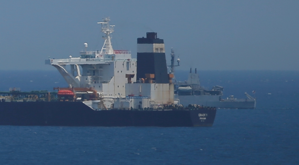 A British Royal Navy patrol vessel guards the oil supertanker Grace 1, that's on suspicion of carrying Iranian crude oil to Syria, as it sits anchored in waters of the British overseas territory of Gibraltar, historically claimed by Spain, July 4, 2019. R