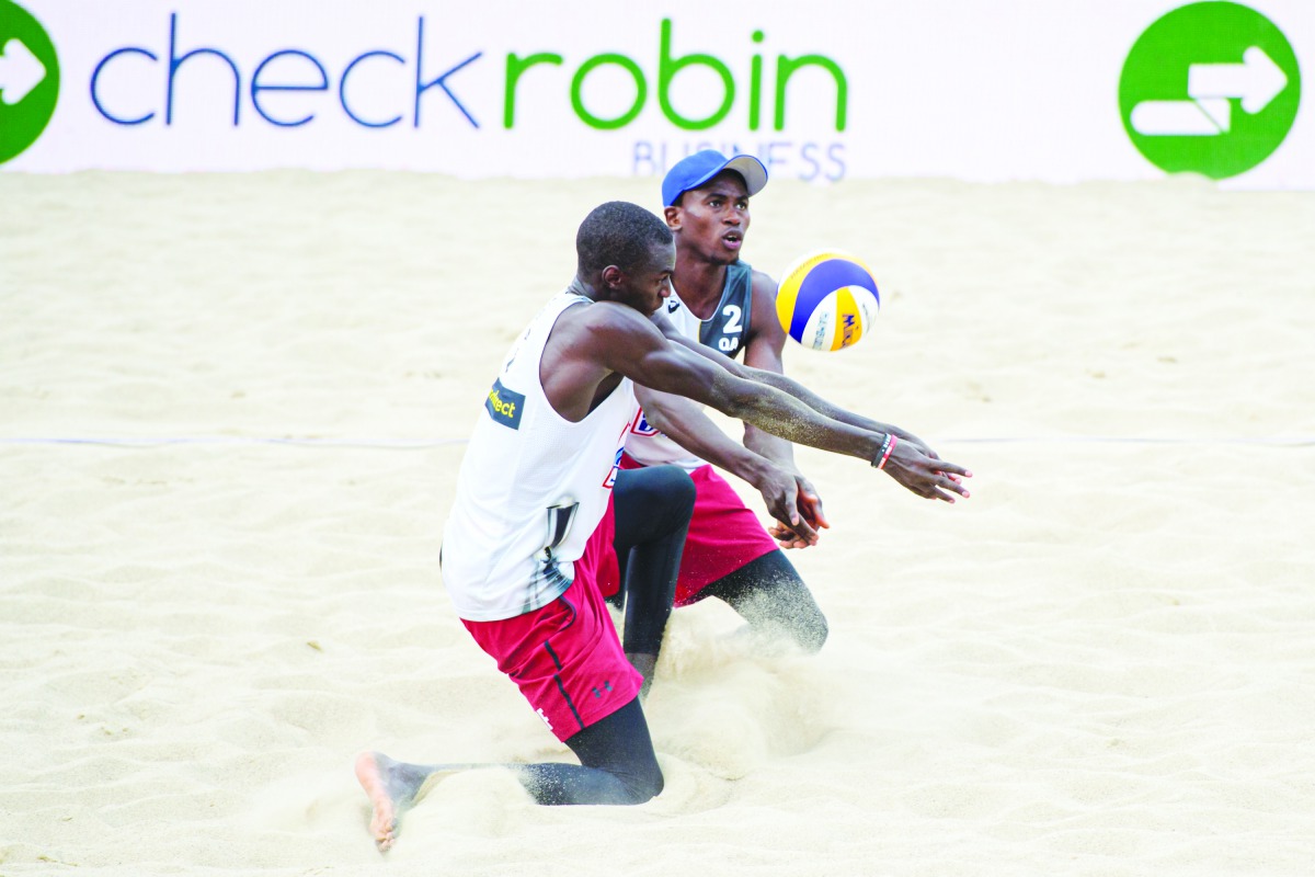 Qatar’s Cherif Younousse and Ahmed Tijan in action in this file photo. 
