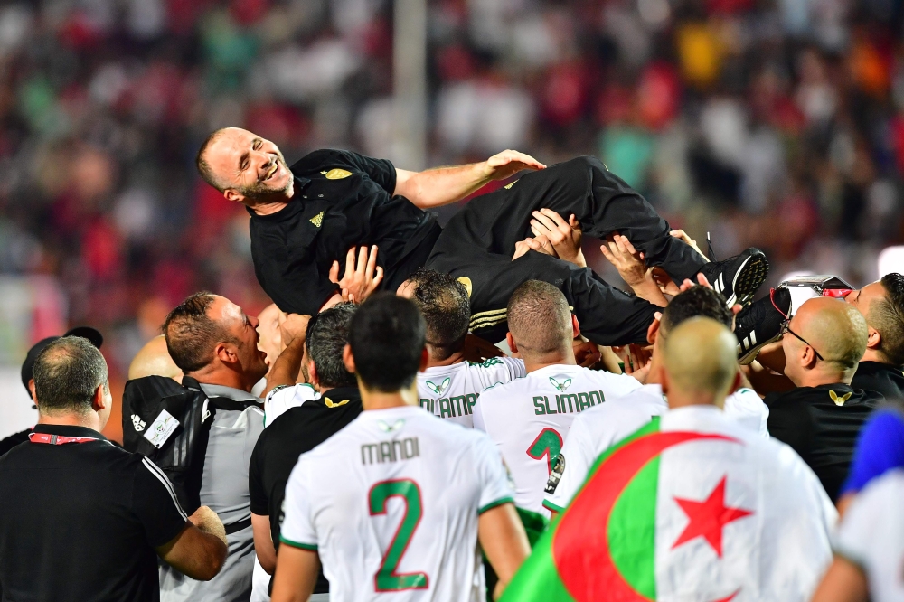 Algeria's coach Djamel Belmadi celebrates after winning the 2019 Africa Cup of Nations (CAN) Final football match between Senegal and Algeria at the Cairo International Stadium in Cairo on July 19, 2019. / AFP / Giuseppe CACACE