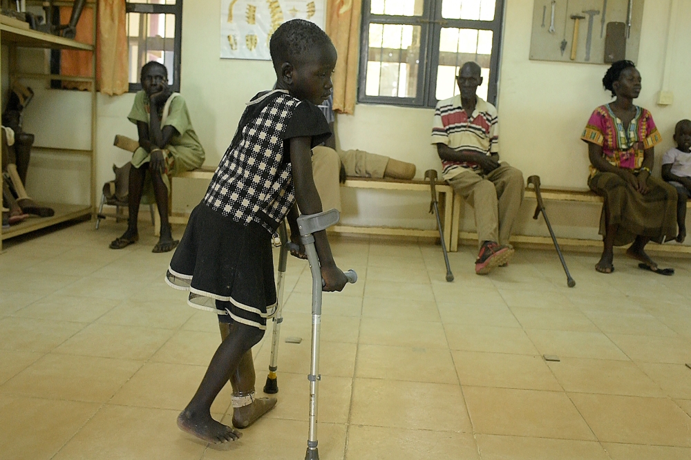 A 5-year-old girl walks with the use of a new prosthetic limb at the physical rehabilitation centre run by the International Committee of the Red Cross in Juba on March 12, 2019. AFP/Simon Maina