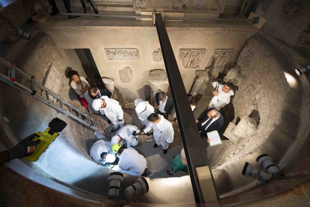 This handout photo made available by the Vatican Media on July 20, 2019 shows the opening of the ossuary at the Teutonic Cemetery in the Vatican as part of a probe into the case of Emanuela Orlandi, a teenager who disappeared in 1983 in one of Italy's dar