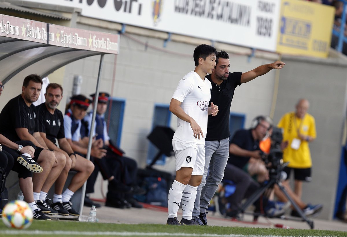 Al Sadd coach Xavi Hernandez bringing in debutant South Korean Nam Tae-Hee during the second half of their pre-season practice match against Palamos in Olot, Spain, on Sunday. 
