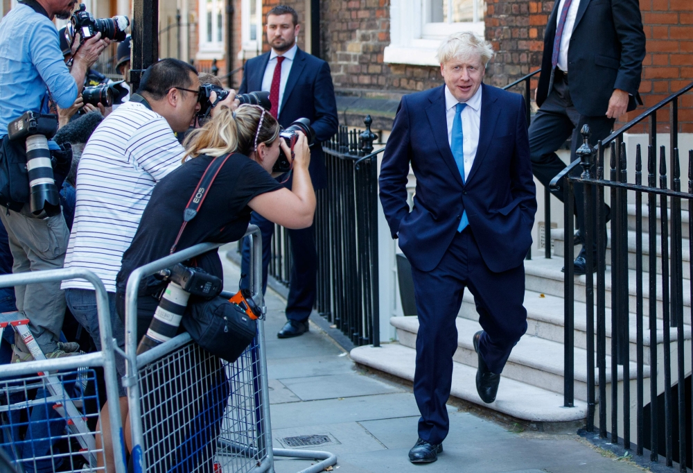New Conservative Party leader and incoming prime minister Boris Johnson leaves his campaign office in central London on July 23, 2019. (AFP / Tolga AKMEN)