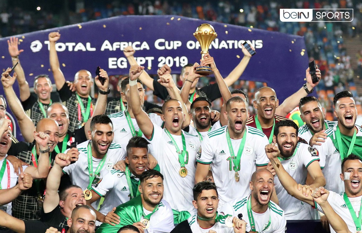 Algerian players and officials celebrate with the trophy after winning the 2019 Africa Cup of Nations title on Friday.