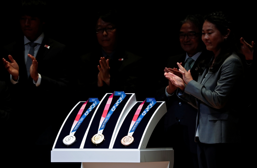 Design of the Tokyo 2020 Olympic medals are unveiled during the 'One Year to Go' ceremony celebrating one year out from the start of the summer games at Tokyo International Forum in Tokyo, Japan July 24, 2019. REUTERS/Issei Kato