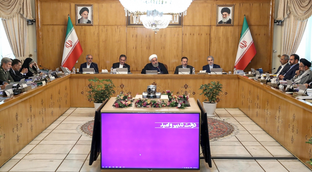 A handout picture provided by the Iranian presidency on July 24, 2019 shows President Hassan Rouhani (C) chairing a cabinet meeting in the capital Tehran. (AFP PHOTO / HO / IRANIAN PRESIDENCY)
