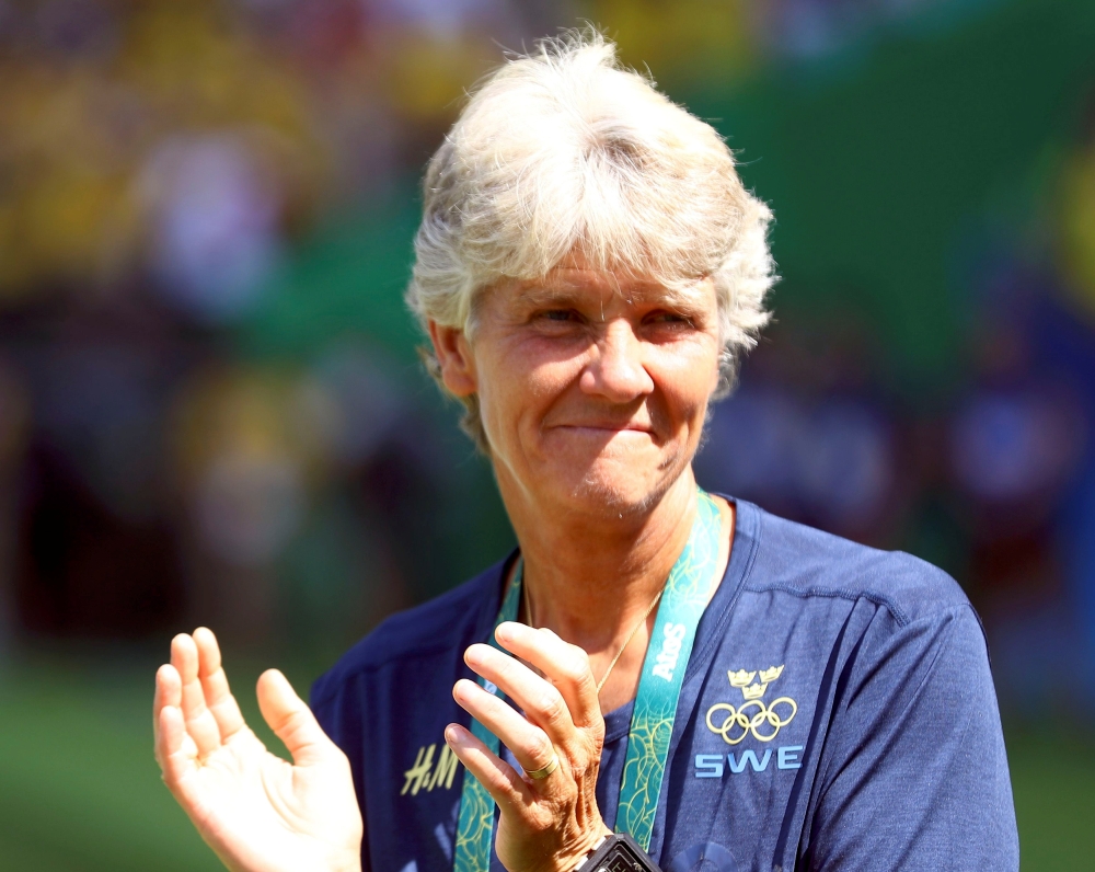 Sweden's women's football team coach Pia Sundhage applauds during a game. (REUTERS/Leonhard Foeger/File photo)