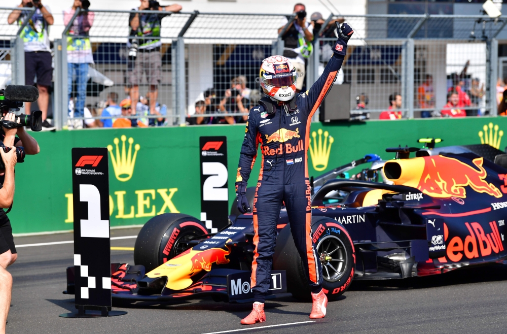 Red Bull's Dutch driver Max Verstappen gives his thumb up after securing his first ever pole position in qualifying of the Formula One Hungarian Grand Prix at the Hungaroring circuit in Mogyorod near Budapest, Hungary, on August 3, 2019. / AFP / Andrej IS