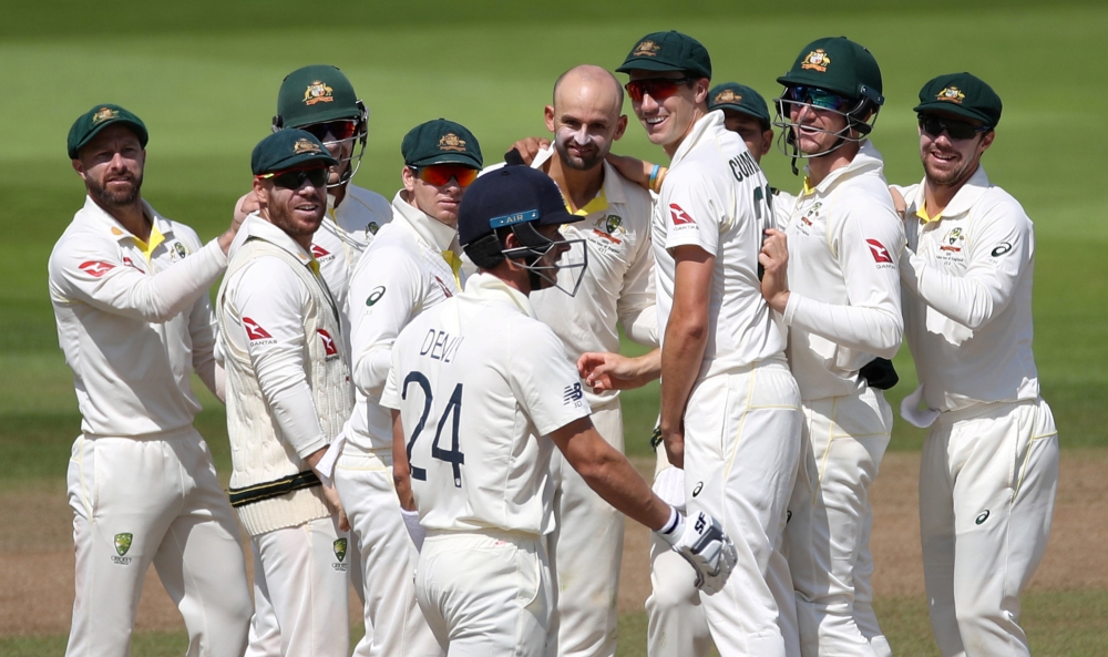 Australia's Nathan Lyon celebrates the wicket of England's Joe Denly with teammates (Reuters/Carl Recine)