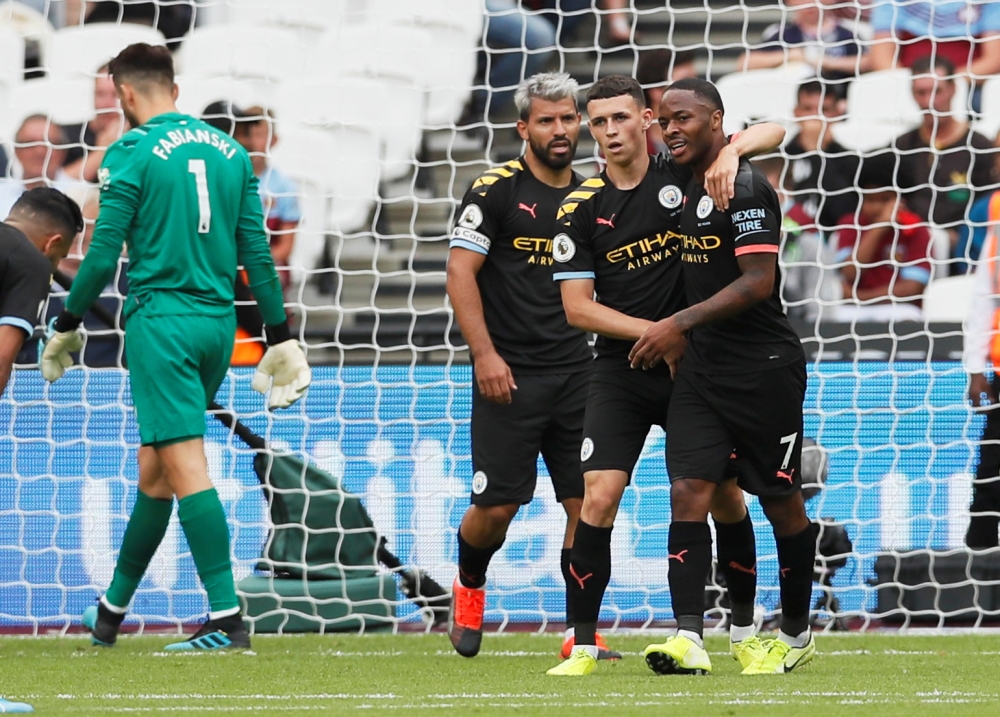 Manchester City's Raheem Sterling celebrates scoring a hat-trick and Manchester City's fifth goal REUTERS/David Klein 