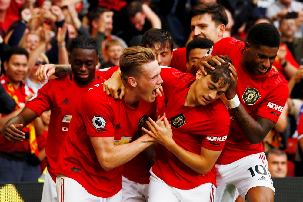 Manchester United's Daniel James celebrates scoring their fourth goal with Scott McTominay, Marcus Rashford and team mates (Reuters/Jason Cairnduff)