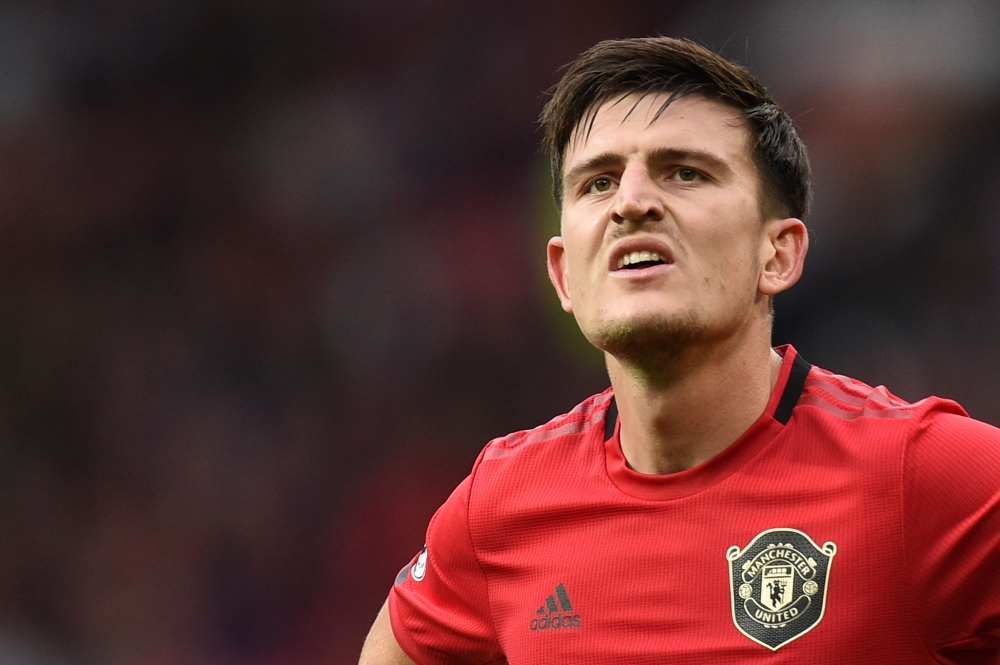 Manchester United's English defender Harry Maguire reacts to their win at the final whistle in the English Premier League football match between Manchester United and Chelsea at Old Trafford in Manchester, north west England, on August 11, 2019.   AFP / O
