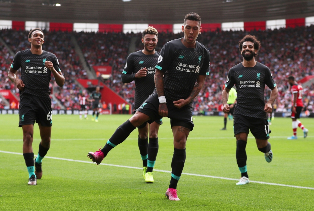 Liverpool's Roberto Firmino celebrates scoring their second goal. (REUTERS/Hannah McKay)