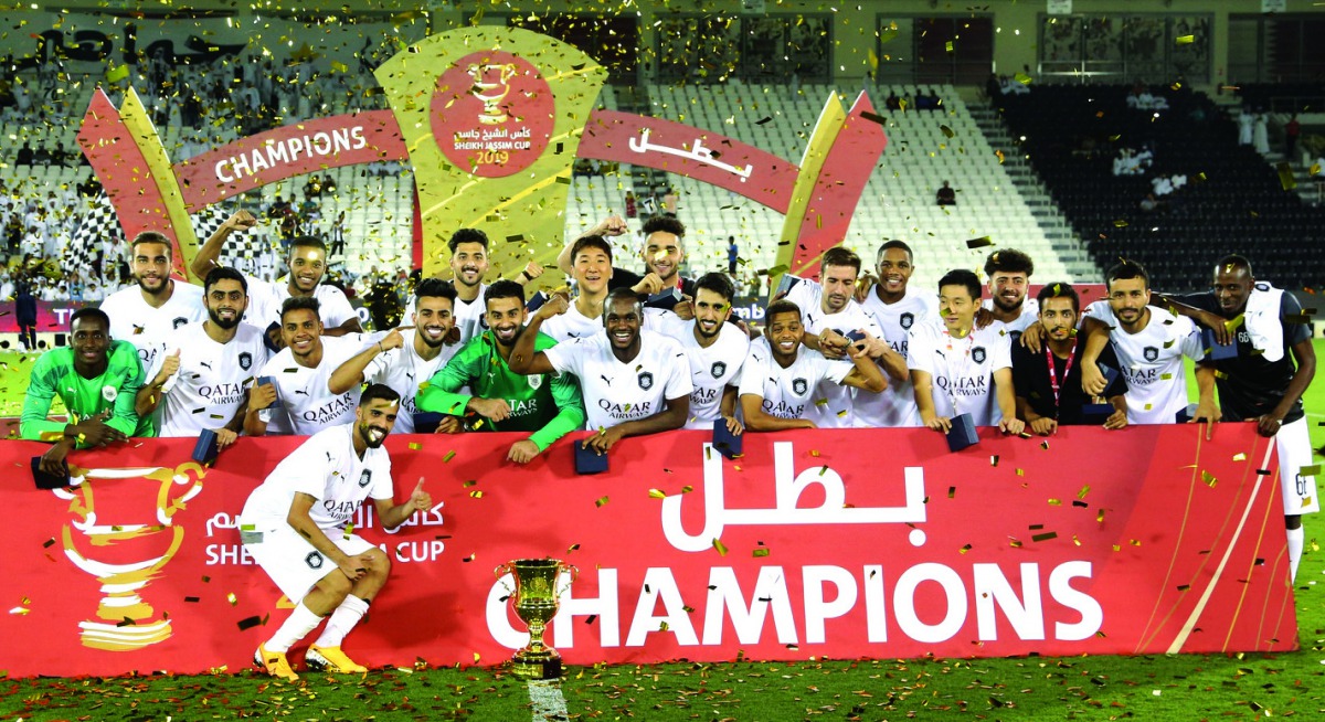 Al Sadd's players and officials celebrate after winning the 2019 Sheikh Jassim Cup after defeating Al Duhail 1-0 at the Jassim Bin Hamad Stadium on Saturday.  Ali Asad scored the winning goal in the 13th minute as Al Sadd, the most successful team in the 
