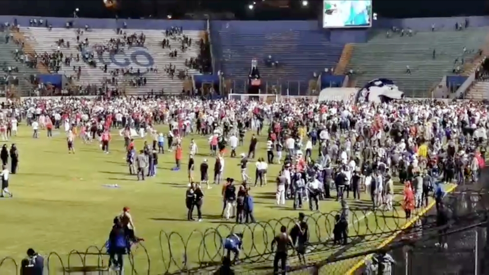 Football fans walk in a football field in Tegucigalpa, Honduras August 17, 2019 in this still image obtained August 18, 2019 from a social media video. 