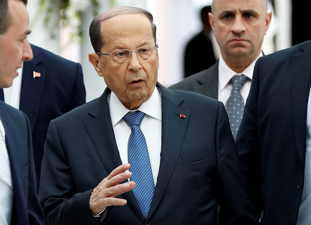 FILE PHOTO: Lebanese President Michel Aoun, gestures upon his arrival at Tunis-Carthage International Airport to attend the Arab Summit, in Tunis, Tunisia March 30, 2019. Hussein Malla/Pool via REUTERS