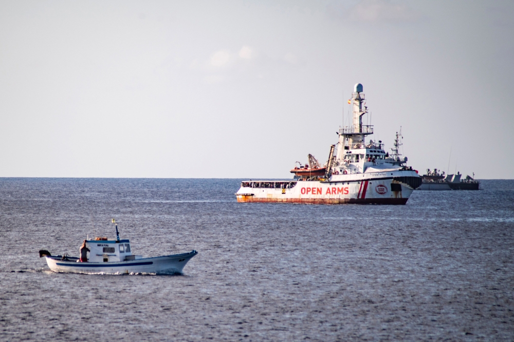 The Spanish migrant rescue NGO ship Open Arms is seen off the coast of the Italian island of Lampedusa on August 17, 2019.   AFP / Alessandro SERRANO