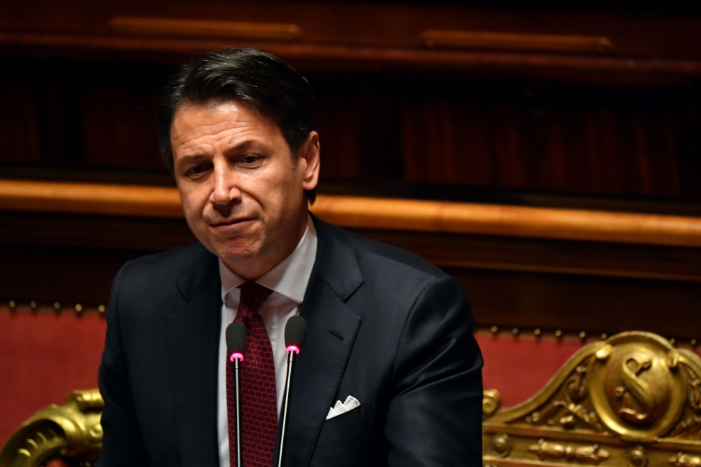 Italian Prime Minister Giuseppe Conte looks on as he delivers a speech at the Italian Senate, in Rome, on August 20, 2019, as the country faces a political crisis. / AFP / Andreas SOLARO 