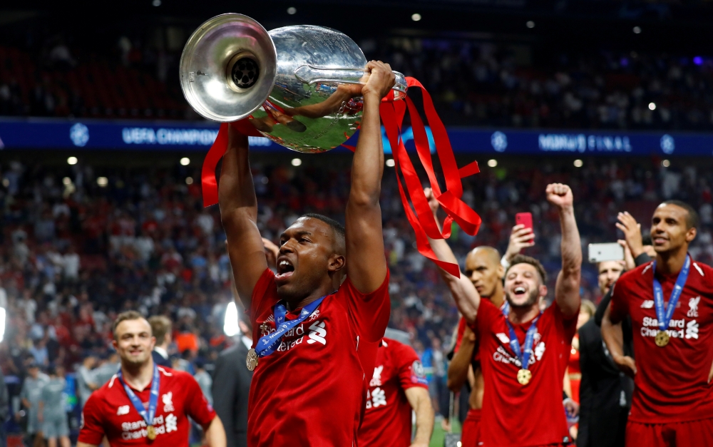 Liverpool's Daniel Sturridge celebrates with the trophy after winning the Champions League REUTERS/Kai Pfaffenbach/File Photo
