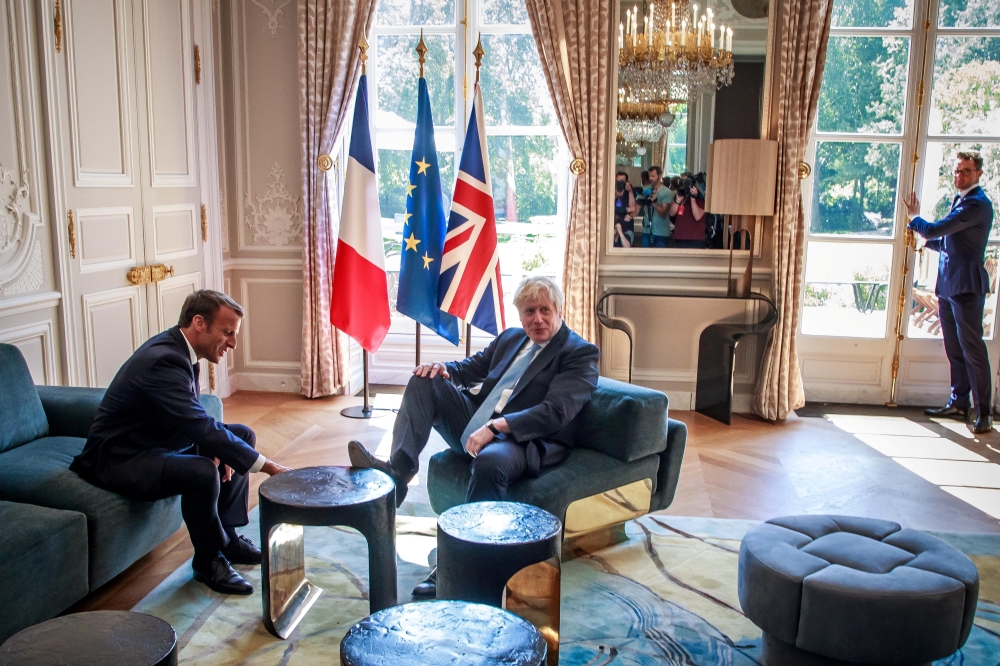 French President Emmanuel Macron and British Prime Minister Boris Johnson speak during a meeting at the Elysee Palace in Paris, France, August 22, 2019. Christophe Petit Tesson/Pool via REUTERS