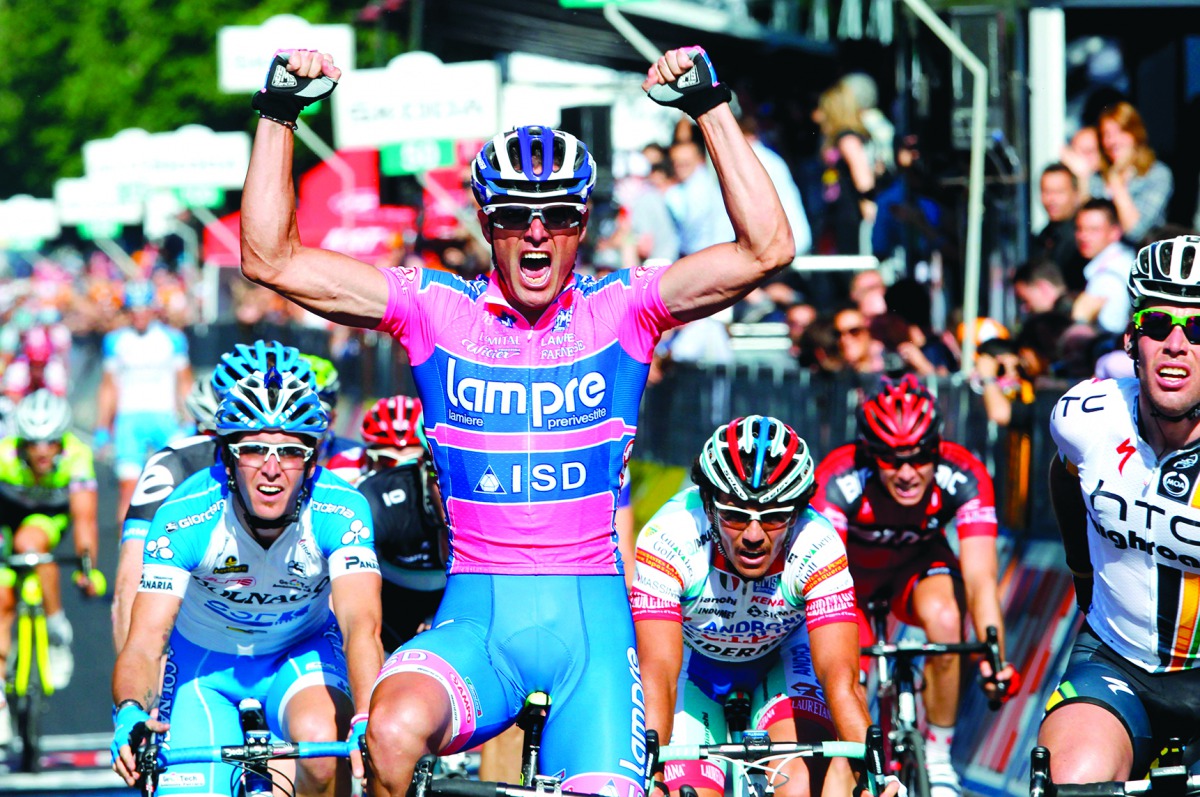 In this file photograph taken on May 8, 2011, Italian sprinter Alessandro Petacchi of the Lampre team celebrates as he crosses the finish line of the second stage of the 94th Giro d'Italia, from Alba to Parma in Parma.  AFP / Luk Benies


