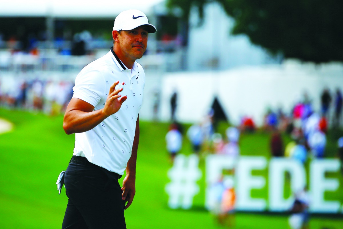 Brooks Koepka reacts after putting on the eighth green during the second round of the Tour Championship golf tournament at East Lake Golf Club. Credit: Butch Dill-USA TODAY Sports 
