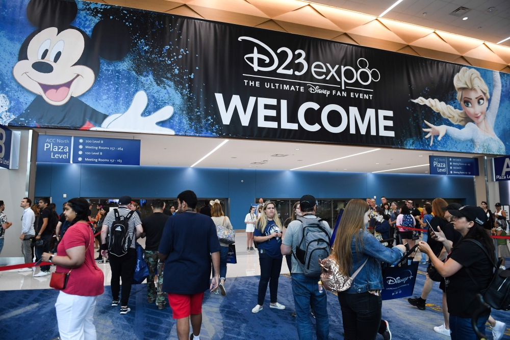 Attendees arrive at the D23 Expo, billed as the 