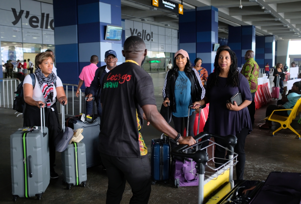 Tani Sanchez and her daughter Tani Sylvester are welcomed by a tour guide upon their arrival with other members of a heritage tour group at Ghana's Kotoka International Airport, Ghana August 6, 2019. Reuters/Francis Kokoroko